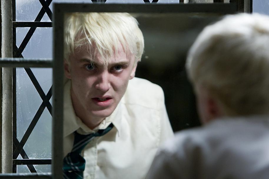 An emotional Draco looking in the mirror 