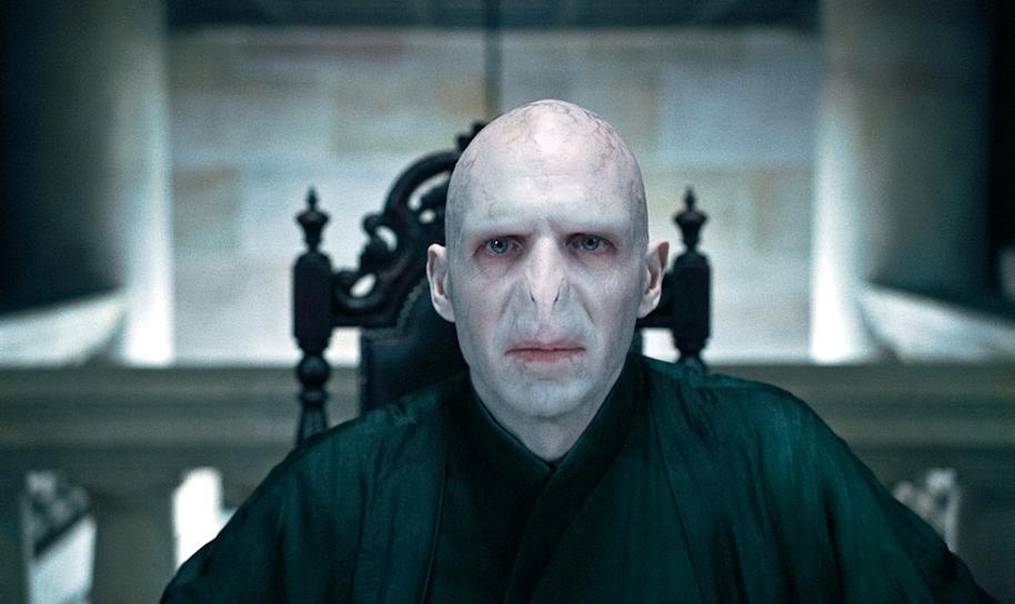 Voldemort stares ahead while in Malfoy Manor in a film still from the Deathly Hallows Part .