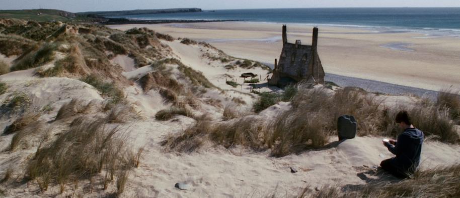 Harry at Dobby's Grave at Shell Cottage.