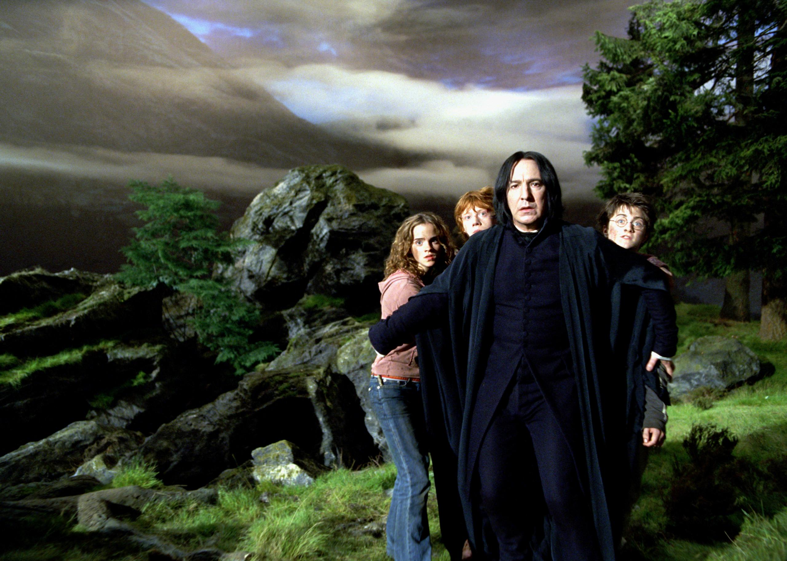 WB F3 SnapeStandsInFrontOfHarryRonAndHermione TRL-022C_UP_HPE3
