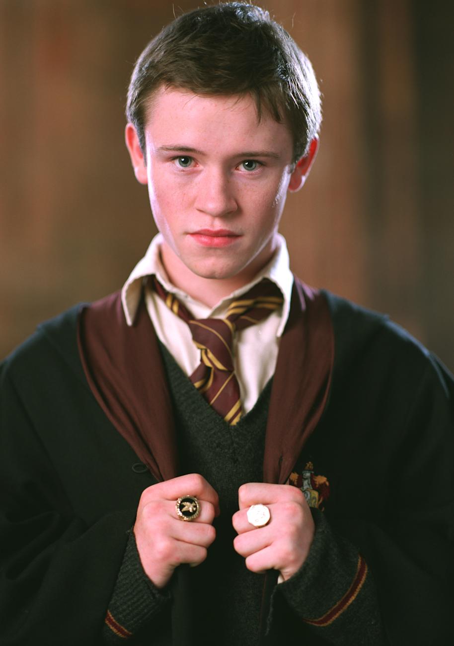 Seamus holding his cloak from the Goblet of Fire 
