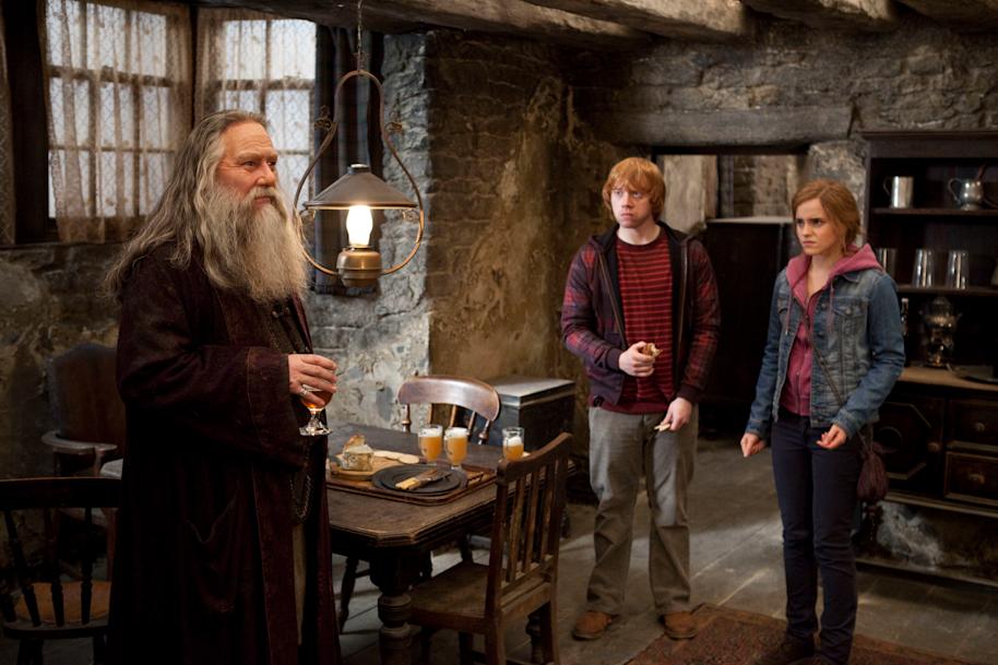 Aberforth Dumbledore standing in the Hog's Head Inn with Ron and Hermione