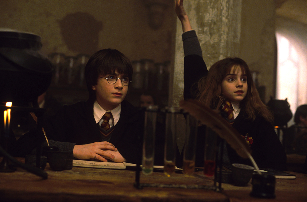 HP-F1-harry-hermione-raised-hand-classroom-web-landscape