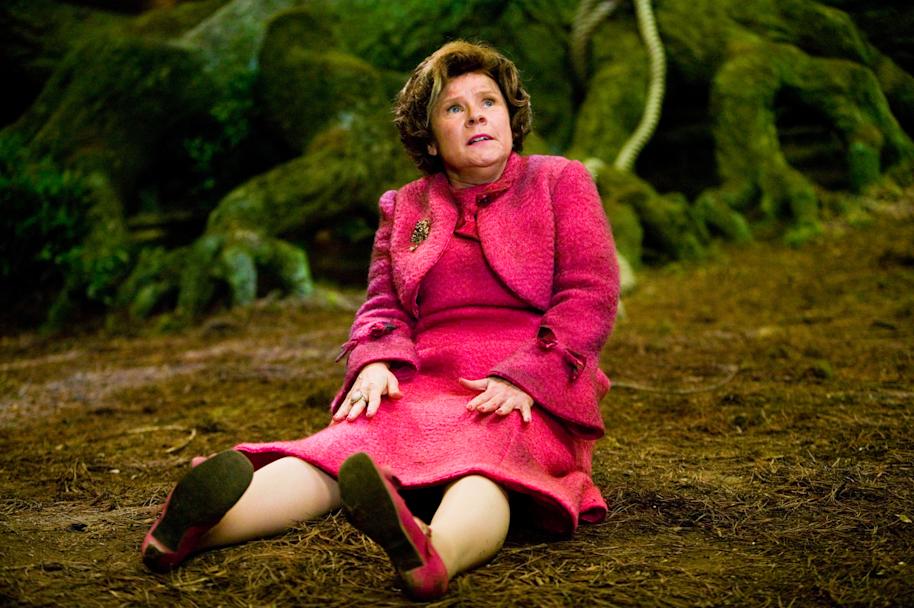 Umbridge sitting on the ground of Forbbiden Forest 