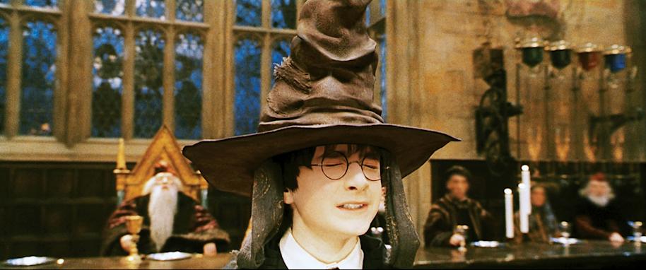 HP-F1-philosophers-stone-harry-sorting-ceremony-sorting-hat-eyes-closed-web-landscape
