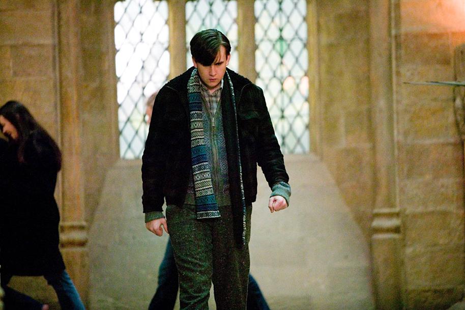 HP-F5-neville-in-layers-walking-down-corridor-web-landscape