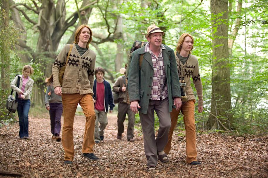 Arthur Weasley leads the group to the Portkey.