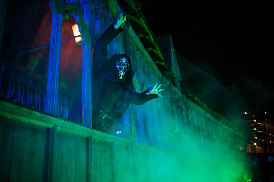 Death Eater standing on the bridge at Hogwarts and pointing their wand