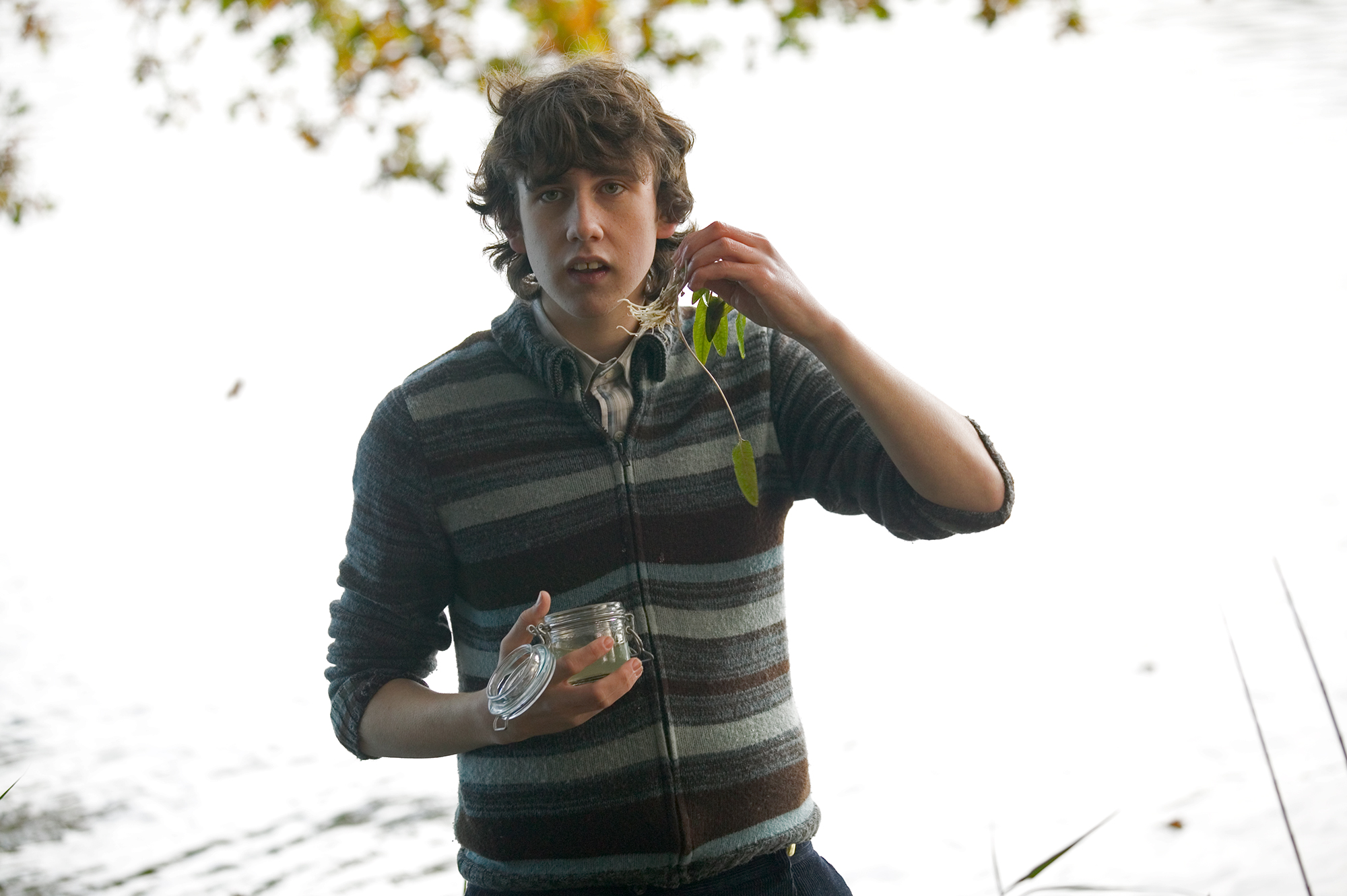 HP-F4-goblet-of-fire-neville-holding-plant-by-lake-web-landscape