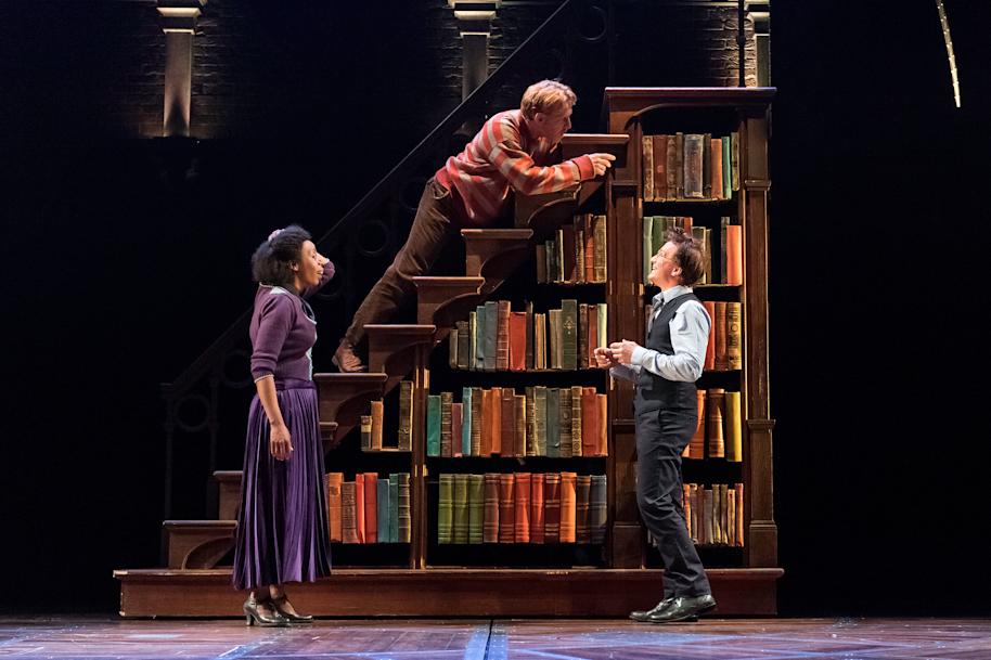 Hermione, Ron and Harry in front of a bookcase, from Harry Potter and the Cursed Child