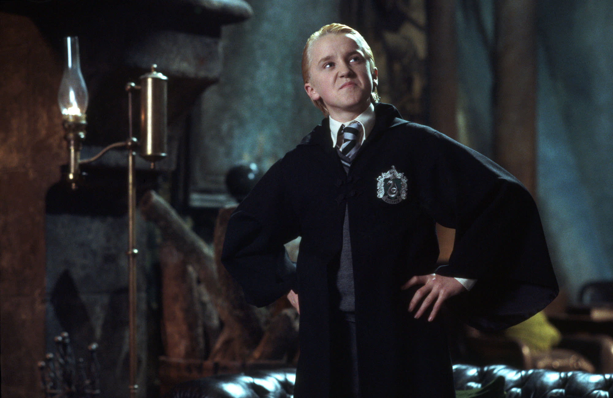 HP-F2-chamber-of-secrets-malfy-slytherin-common-room-smug-hands-on-hips-web-landscape
