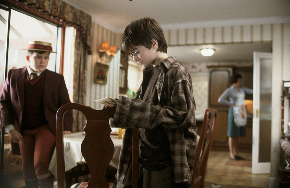 HP-F1-harry-looking-at-hogwarts-letter-web-landscape